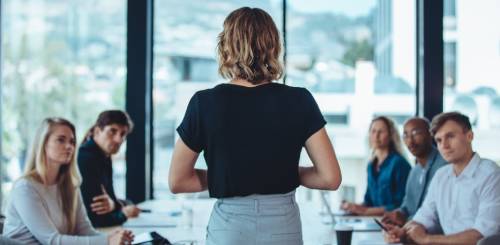 Woman leading business meeting in office.